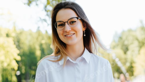 Preview: Headshot portrait positive cute young woman wearing eyeglasses and white shirt