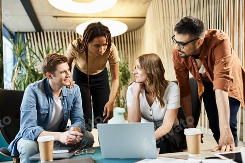 Preview: Collaborative innovation: team gathering around laptop