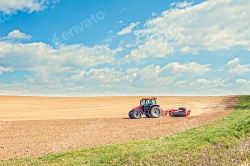 Preview: Tractor compresses the soil after planting with rollers.