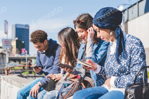 Preview: Multiracial group young people using smartphone