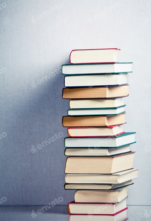 Preview: Very high stack of books