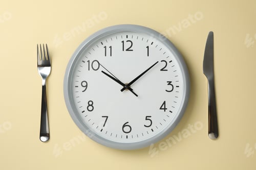 Preview: Clock, knife and fork on beige background, top view