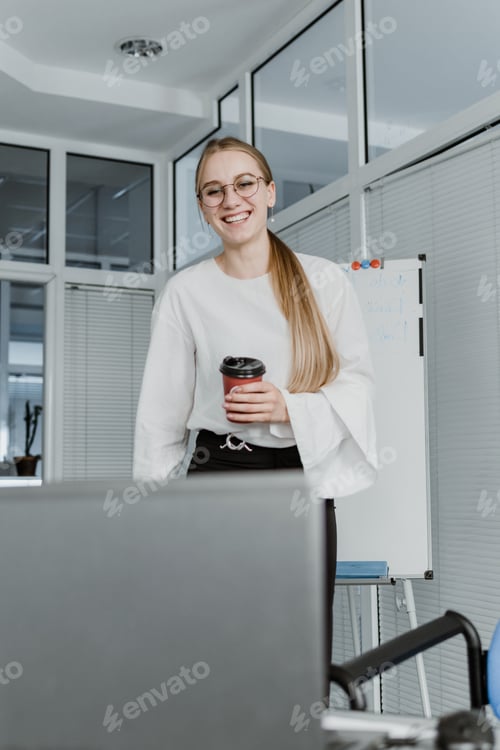 Preview: Remote Meetings, Video Conferencing. Young business woman drinking coffee and communicating with