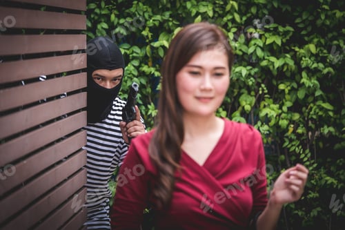 Preview: Thief is holding a gun and looking at asian woman