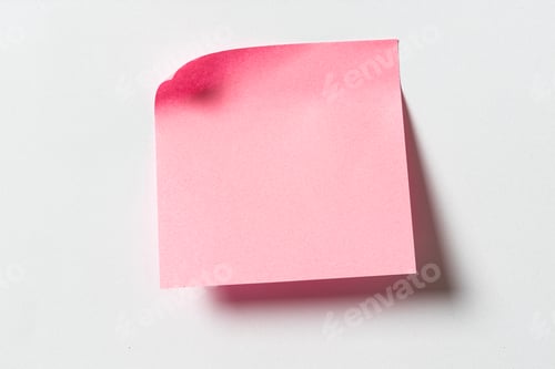 Preview: Blank pink sticky note on white wall