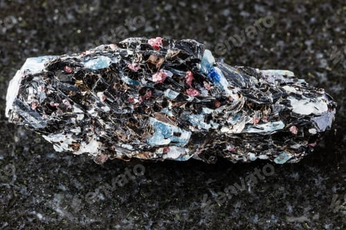Preview: sample of rough kyanite in biotite rock on black