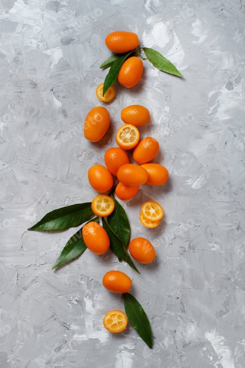 Preview: Kumquat fruits on a grey background