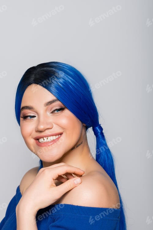 Preview: positivity and youth, tattooed woman with closed eyes and dyed hair