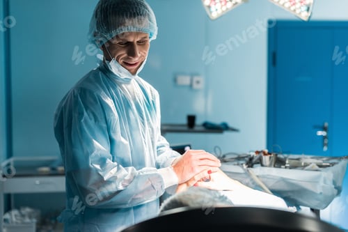 Preview: smiling doctor and patient holding hands in operating room