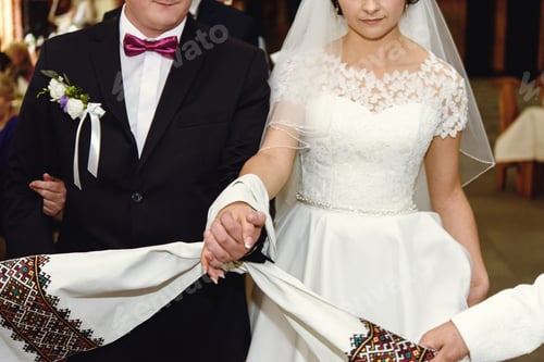 Preview: wedding ceremony of stylish elegant brunette bride and groom win the old church