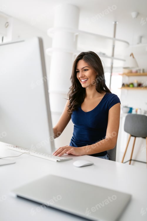 Preview: Beautiful happy woman working on computer. Technology business education social network concept