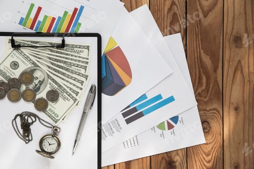 Preview: Business Finance Charts and Money on Table