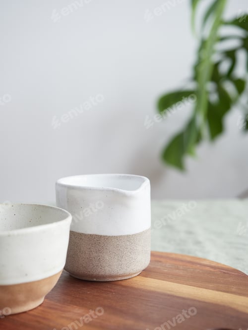 Preview: small ceramic jug and bowl in white and terracotta on wood. Kitchenware