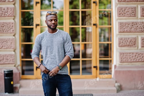 Stylish Man in Gray Shirt Posing Outdoors