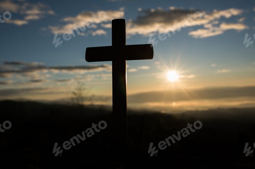 Preview: Silhouette of catholic cross and sunrise