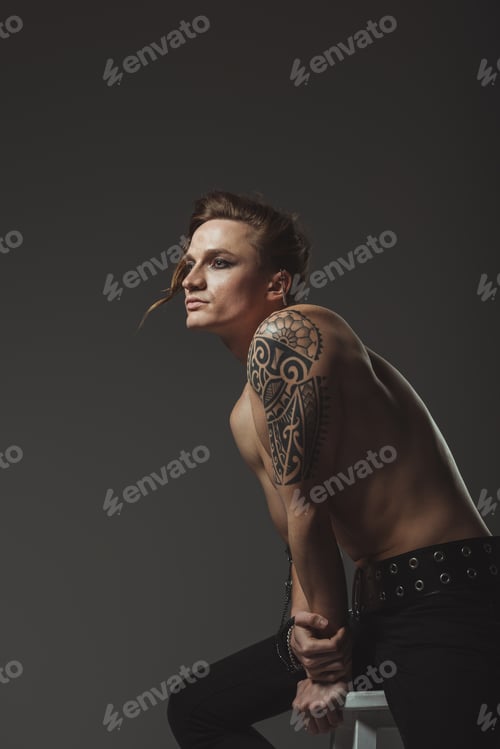 Preview: handsome shirtless man with strange hairstyle, isolated on grey