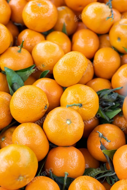 Preview: Fresh tangerines or mandarin, oranges fruit with leaves, citrus background.