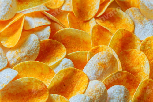 Preview: Potato chips on a wooden billet. Rippled fresh organic potato chips background.