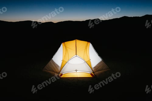 Preview: Illuminated camping tent in vast desert at dusk, Black Rock Desert, Nevada