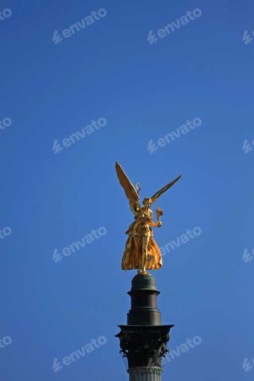 Preview: Golden Angel Sculpture Front Of Blue Sky In Munich