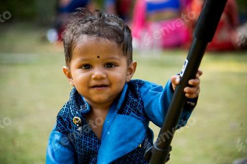 Preview: The one year old cute boy play in garden