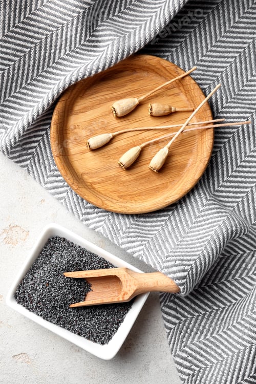 Preview: Flat lay composition with poppy seeds on grey background