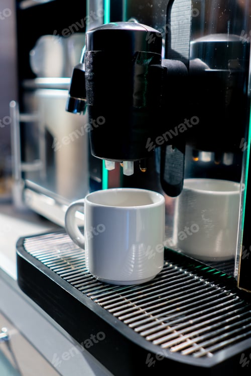Preview: close-up of the process of making fragrant coffee with an automatic coffee machine in a hotel