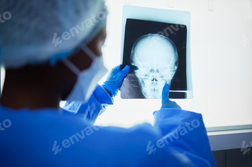 Preview: Doctor Examining X-ray Image in Hospital Setting