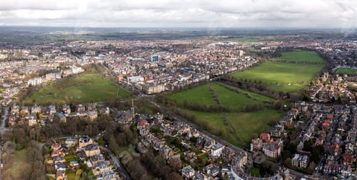 Preview: Aerial townscape view of Harrogate with traffic and The Stray public park