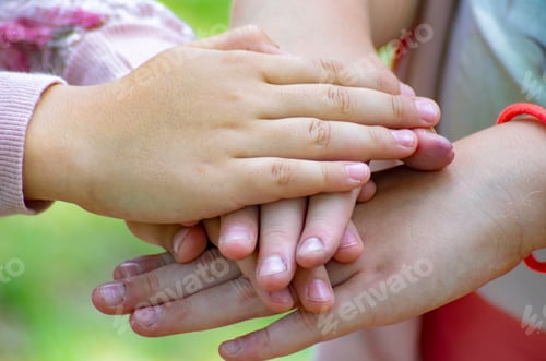 Preview: children hold each other's hands, arms folded symbolizing unity
