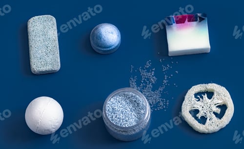 Preview: different body care items on blue color.