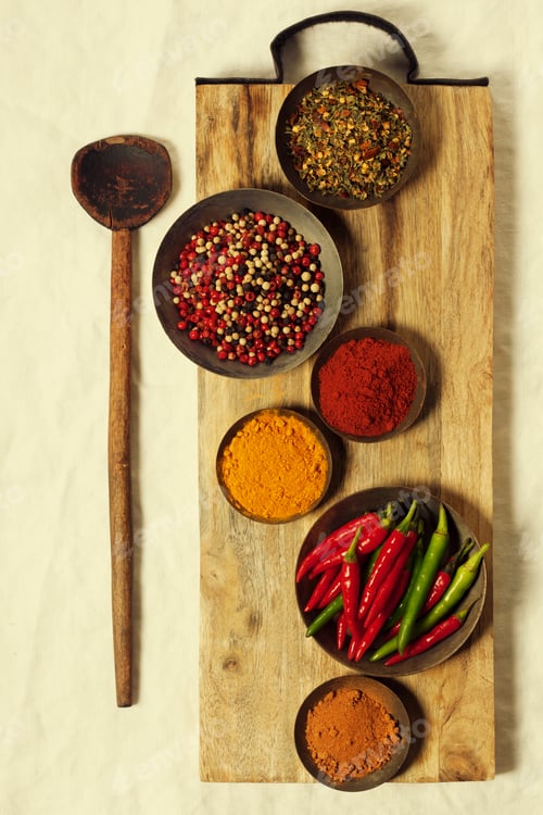 Preview: Different spices in bowls on table