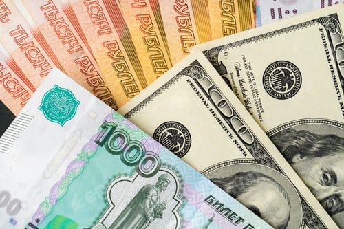 Preview: US Dollar and Russian Ruble banknotes close up