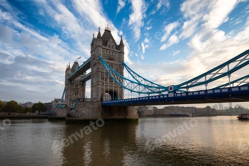 Preview: Historic Bridge over River Thames and Cityscape Skyline during dramatic sunrise.