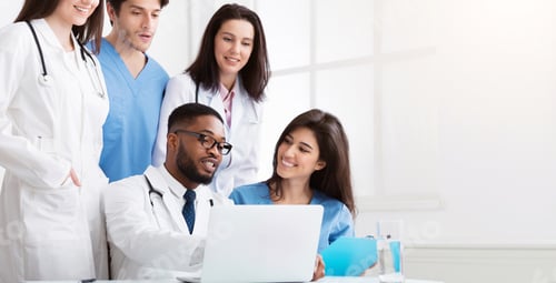 Preview: Team of interns and practitioners examining medical reports