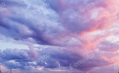 Preview: Gorgeous clouds highlighted by sunset all in different tones of pink and purple