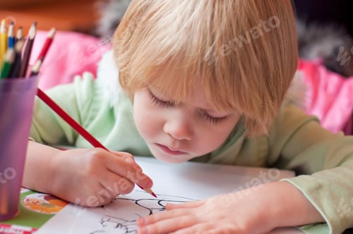 Preview: Little girl drawing coloring with color pencils. Kids art and creativity.