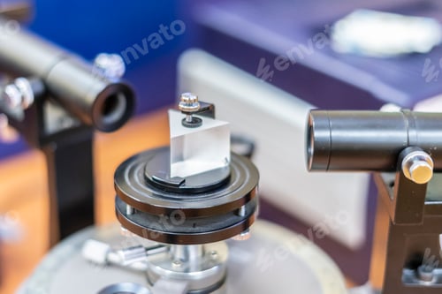 Preview: young man conduct experiments with magnifyer glass or optic lens b