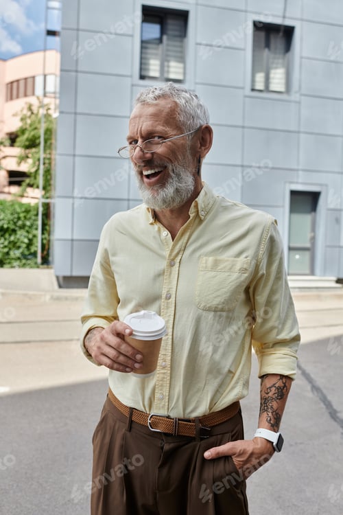 Preview: Smiling teacher with coffee on a sunny day