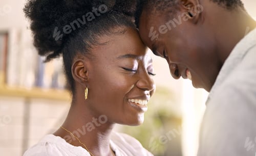 Preview: The look of love looks good on you. Shot of a young couple relaxing together at home.
