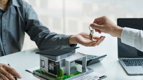 Preview: Real estate agent hand over the house key to customers after signing a real estate sales contract