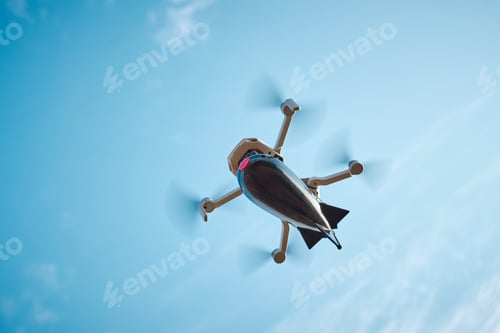 Preview: drone with a bomb for fishing on board flies in the sky