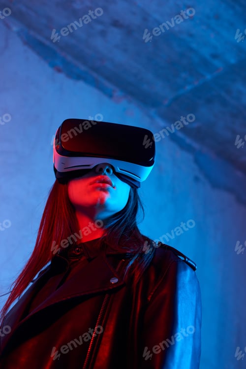 Preview: Young girl using virtual reality helmet while wearing a jacket