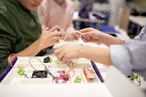 Preview: children with building kit at robotics school