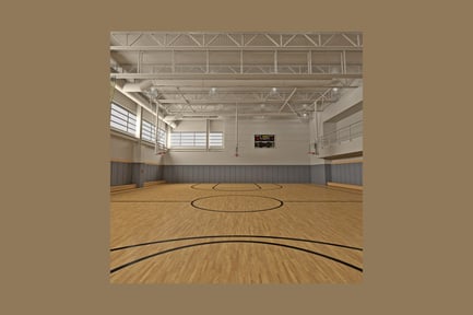 Preview: Indoor basketball court with spectator seating