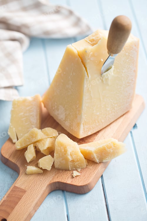 Preview: parmesan cheese on cutting board