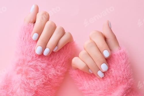 Preview: Close up womans hands with white manicure