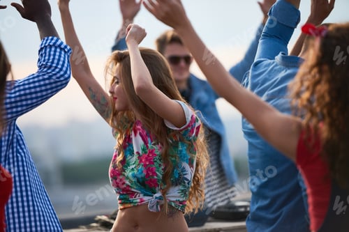 Preview: Young Caucasian Woman Dancing Outdoors with Diverse Friends during Daytime