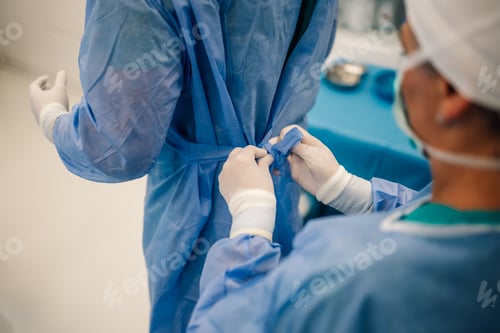 Preview: Surgeons Gowning Up in Preparation for Operation