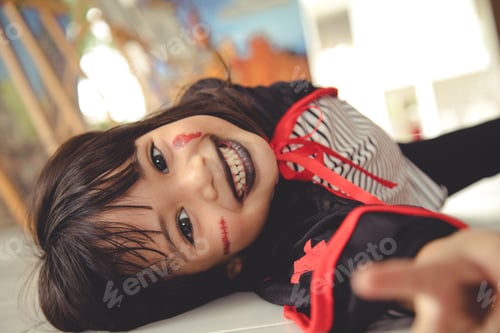 Preview: Funny child dressed Halloween costume. Halloween holidays concept